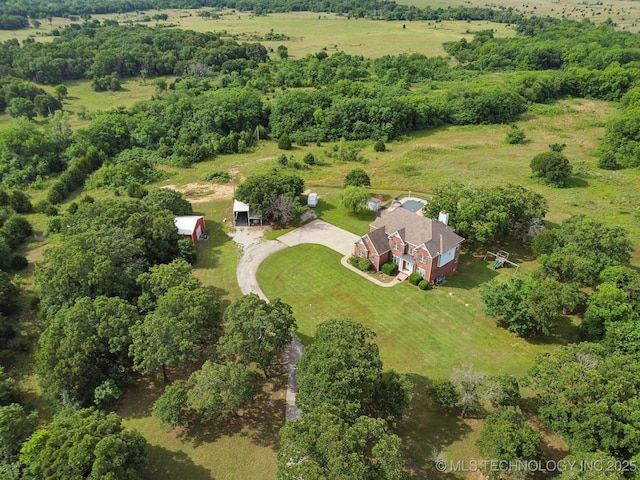 birds eye view of property with a rural view