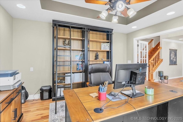 office area with a ceiling fan, baseboards, recessed lighting, and light wood-style flooring