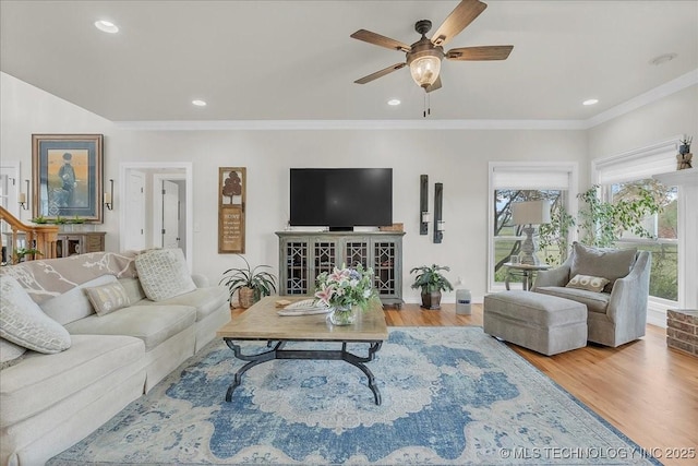 living room featuring crown molding, recessed lighting, ceiling fan, and wood finished floors