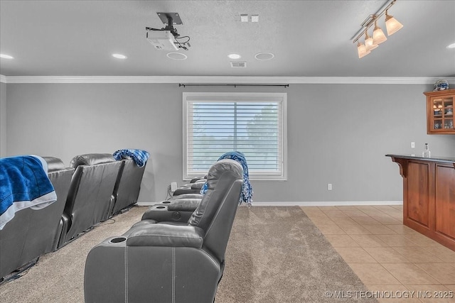 home theater room with crown molding, recessed lighting, baseboards, and light tile patterned floors