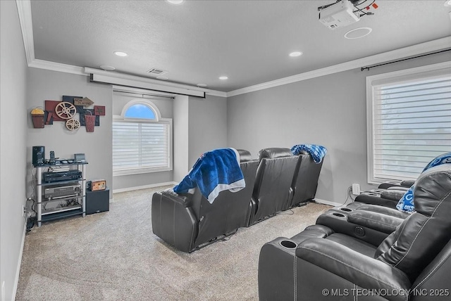 carpeted home theater with baseboards, ornamental molding, recessed lighting, and visible vents