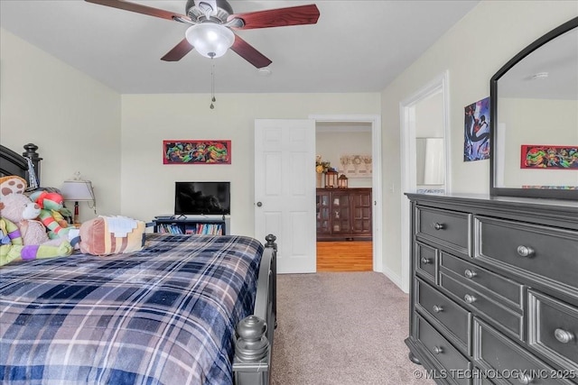 carpeted bedroom with ceiling fan