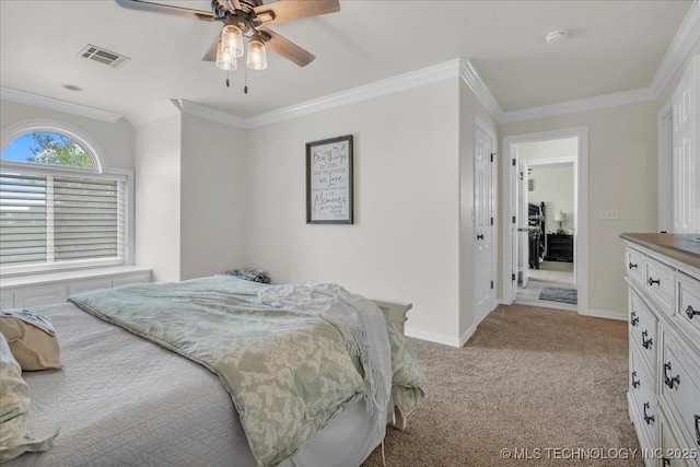 carpeted bedroom with visible vents, baseboards, crown molding, and ceiling fan
