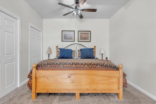 carpeted bedroom featuring baseboards and ceiling fan