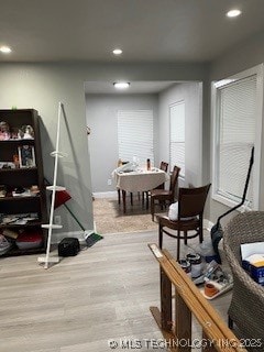 interior space featuring baseboards, recessed lighting, and wood finished floors