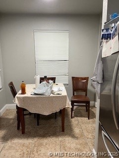 dining room featuring baseboards