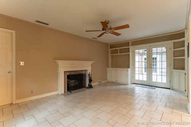 3505 S Birmingham Ave, Tulsa, OK 74105 - unfurnished living room with ceiling fan, french doors, a fireplace, built in shelves, and ornamental molding