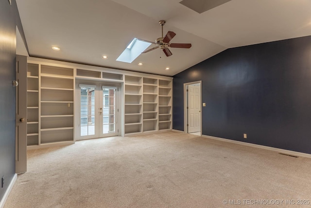 3505 S Birmingham Ave, Tulsa, OK 74105 - spare room featuring ceiling fan, a skylight, vaulted ceiling, carpet, and recessed lighting