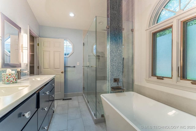 3505 S Birmingham Ave, Tulsa, OK 74105 - full bathroom with vanity, a freestanding bath, a stall shower, plenty of natural light, and recessed lighting