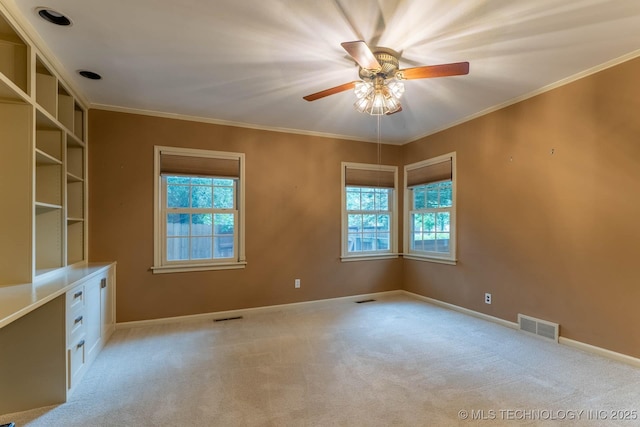 3505 S Birmingham Ave, Tulsa, OK 74105 - empty room featuring healthy amount of natural light, light carpet, ceiling fan, and crown molding