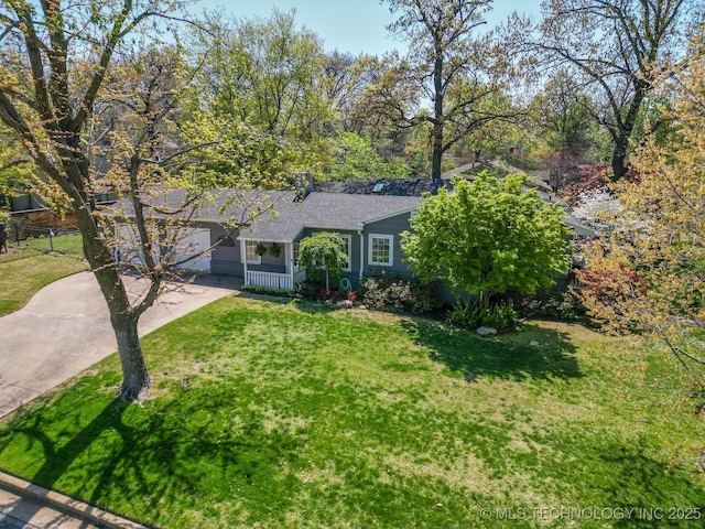 3505 S Birmingham Ave, Tulsa, OK 74105 - view of front of property featuring driveway, a front yard, and roof with shingles