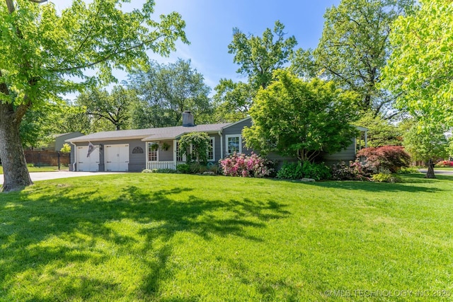 3505 S Birmingham Ave, Tulsa, OK 74105 - view of front of home with a garage, concrete driveway, and a chimney
