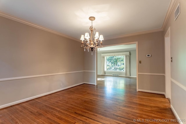 3505 S Birmingham Ave, Tulsa, OK 74105 - unfurnished room with a chandelier, wood finished floors, and crown molding