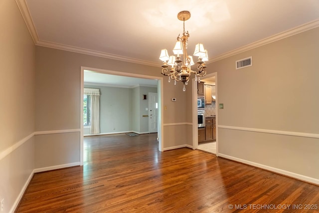 3505 S Birmingham Ave, Tulsa, OK 74105 - unfurnished room featuring wood finished floors, a chandelier, and crown molding