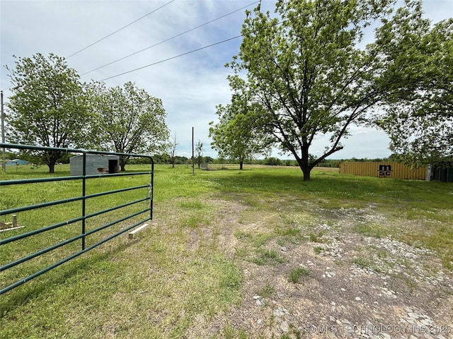 view of yard featuring fence and a gate
