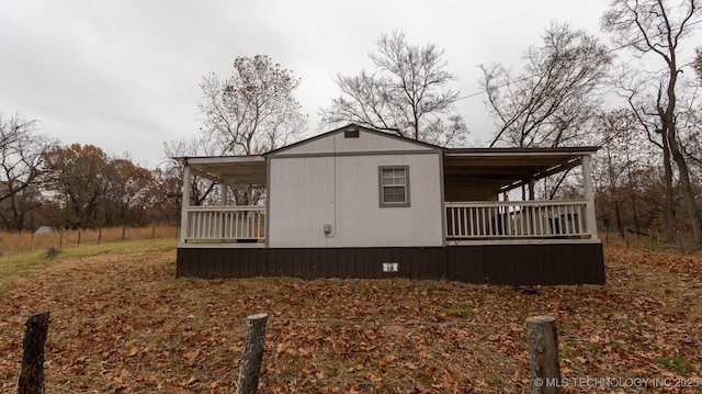 view of property exterior featuring covered porch