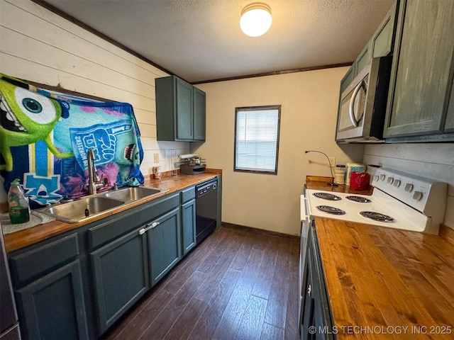kitchen featuring butcher block countertops, stainless steel microwave, black dishwasher, a sink, and white electric range