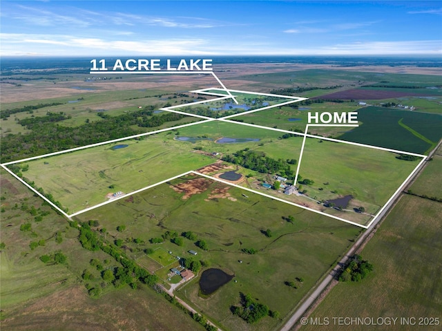 birds eye view of property featuring a rural view