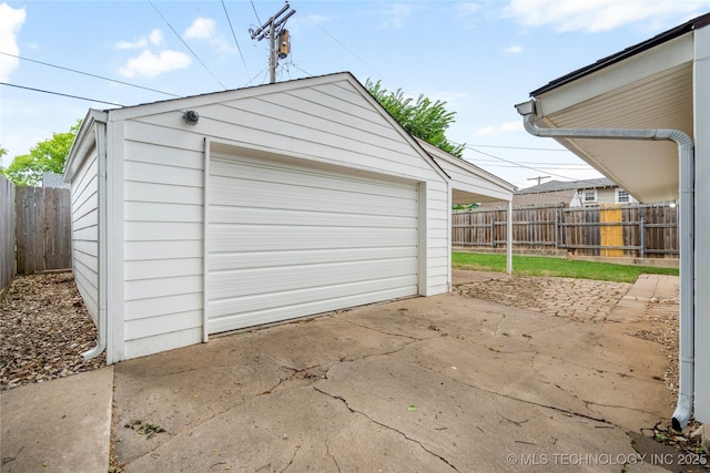 1212 S Knoxville Ave, Tulsa, OK 74112 - detached garage with fence and driveway
