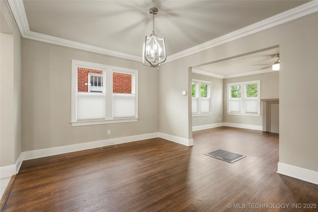 1212 S Knoxville Ave, Tulsa, OK 74112 - spare room featuring crown molding, dark wood-style floors, visible vents, and baseboards