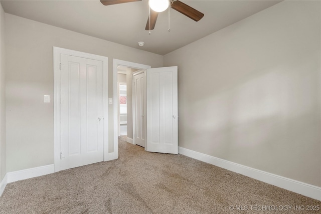 1212 S Knoxville Ave, Tulsa, OK 74112 - unfurnished bedroom featuring baseboards, ceiling fan, and carpet flooring
