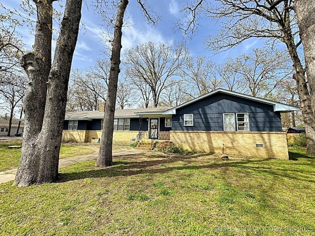 single story home with brick siding, a front lawn, and crawl space