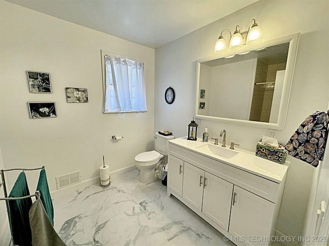 full bath with visible vents, vanity, baseboards, toilet, and marble finish floor