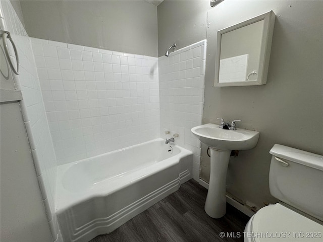 2122 N Florence Ave, Tulsa, OK 74110 - bathroom featuring wood finished floors, toilet, and shower / tub combination
