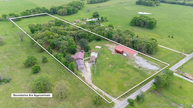birds eye view of property with a rural view