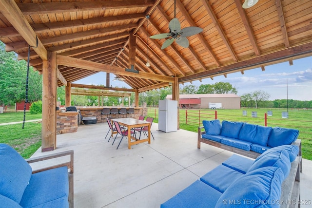 view of patio with ceiling fan, fence, a gazebo, an outdoor hangout area, and area for grilling