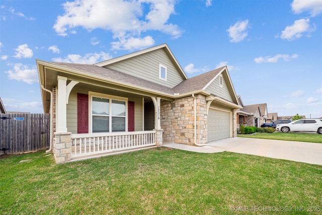 12314 N 131st E Ave, Collinsville, OK 74021 - view of front of property featuring a porch, a garage, stone siding, concrete driveway, and roof with shingles