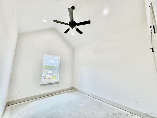 empty room with a ceiling fan, concrete flooring, baseboards, lofted ceiling, and recessed lighting