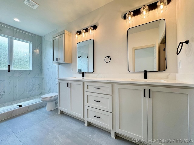 566 Woodlands Dr, Tahlequah, OK 74464 - bathroom with a marble finish shower, double vanity, and tile patterned floors