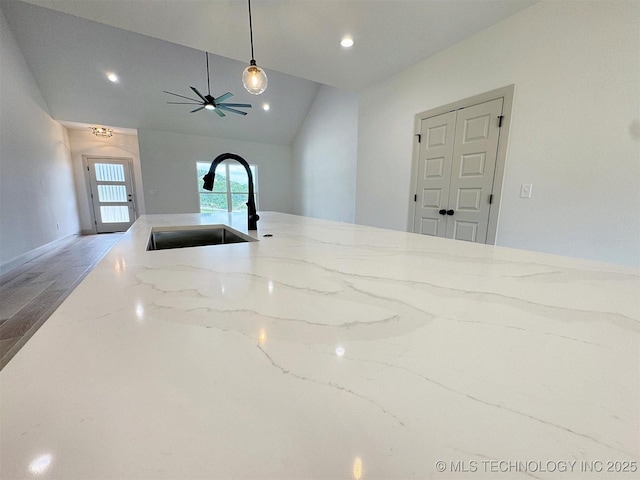 566 Woodlands Dr, Tahlequah, OK 74464 - kitchen with a sink, vaulted ceiling, light stone counters, pendant lighting, and recessed lighting