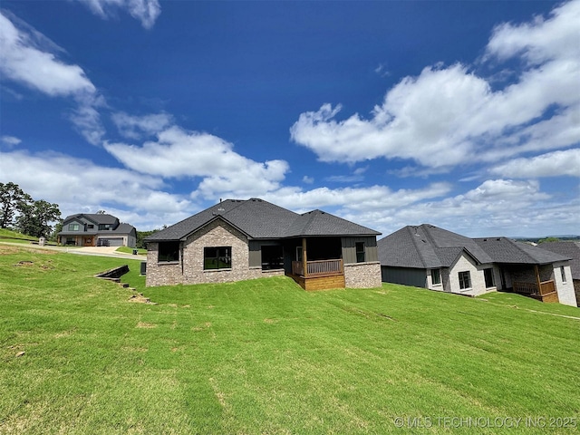 566 Woodlands Dr, Tahlequah, OK 74464 - rear view of house with a lawn and brick siding