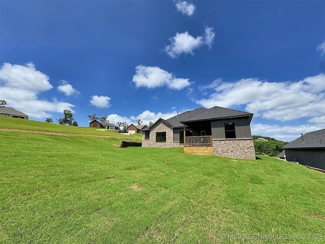 566 Woodlands Dr, Tahlequah, OK 74464 - rear view of house with a lawn and brick siding