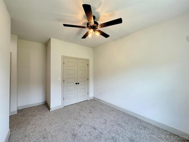 566 Woodlands Dr, Tahlequah, OK 74464 - unfurnished bedroom with a closet, baseboards, carpet flooring, and ceiling fan