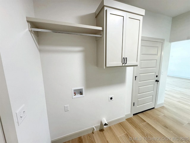 566 Woodlands Dr, Tahlequah, OK 74464 - laundry room with hookup for an electric dryer, cabinet space, washer hookup, light wood-type flooring, and baseboards