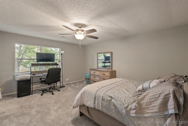 bedroom with baseboards, ceiling fan, a textured ceiling, and light colored carpet