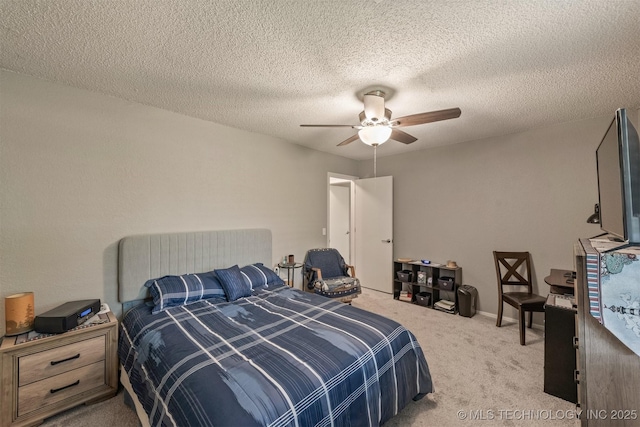 bedroom with ceiling fan and carpet