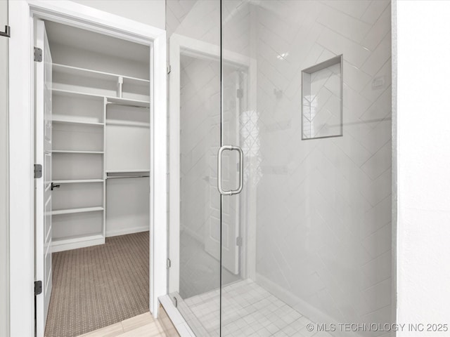 13651 S 26th St, Jenks, OK 74008 - bathroom featuring a spacious closet and a stall shower
