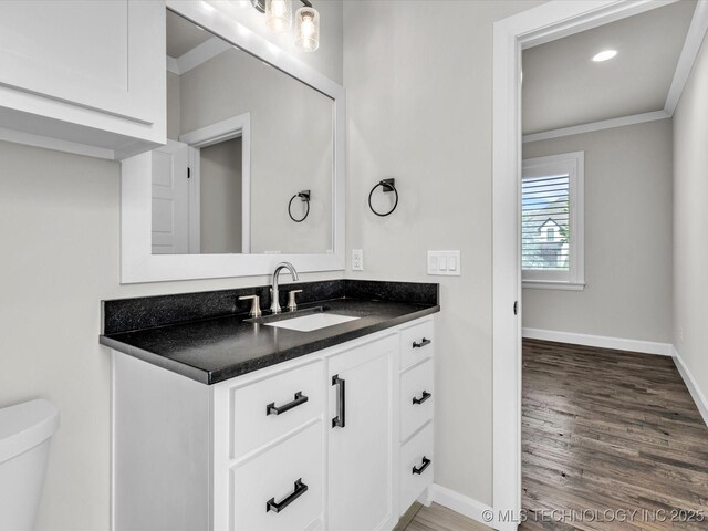 13651 S 26th St, Jenks, OK 74008 - half bath with ornamental molding, baseboards, wood finished floors, vanity, and toilet