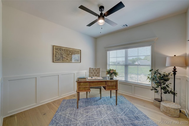 1500 N 72nd St, Broken Arrow, OK 74014 - home office with visible vents, ceiling fan, light wood-style flooring, and a decorative wall