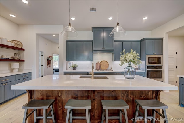 1500 N 72nd St, Broken Arrow, OK 74014 - kitchen featuring tasteful backsplash, visible vents, stainless steel appliances, light countertops, and light wood-style floors