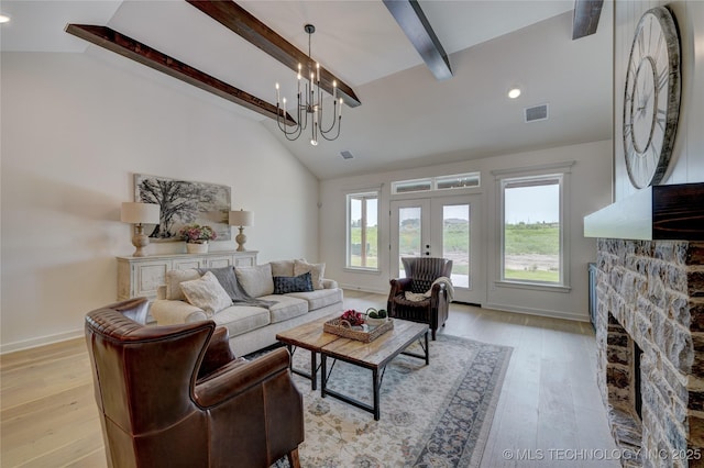 1500 N 72nd St, Broken Arrow, OK 74014 - living area with beam ceiling, visible vents, french doors, and light wood-style flooring