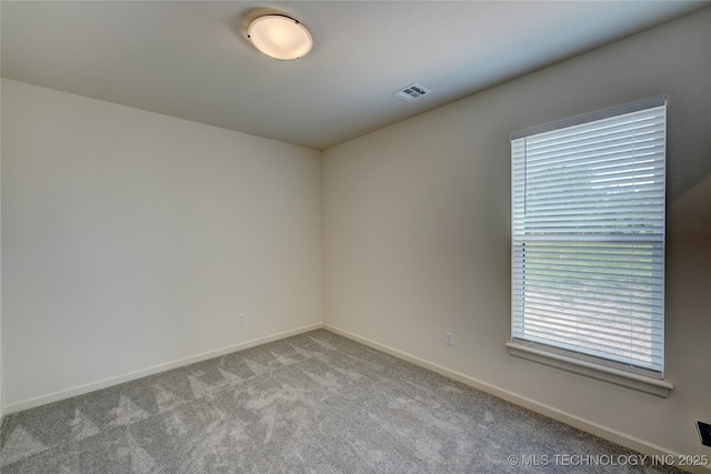 1500 N 72nd St, Broken Arrow, OK 74014 - spare room featuring baseboards, visible vents, and carpet floors