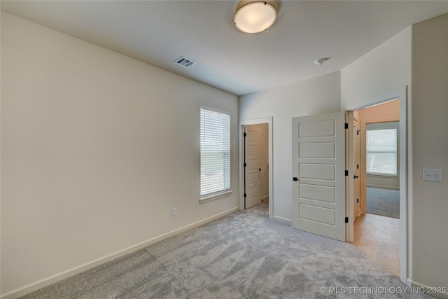 1500 N 72nd St, Broken Arrow, OK 74014 - unfurnished bedroom featuring carpet flooring, visible vents, and baseboards