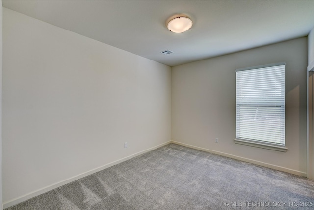 1500 N 72nd St, Broken Arrow, OK 74014 - empty room featuring visible vents, carpet, and baseboards