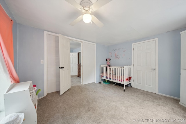 carpeted bedroom featuring a ceiling fan