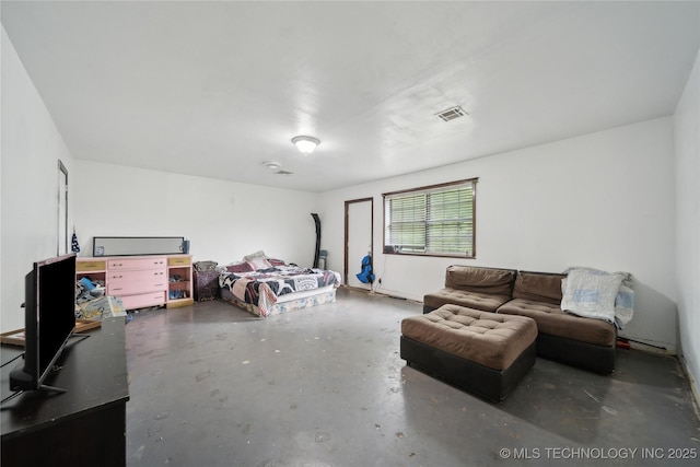 bedroom with visible vents and unfinished concrete flooring